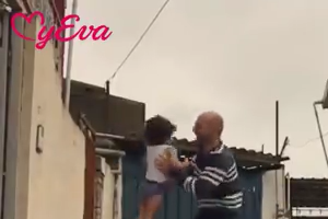 Baby performing skills with her dad