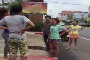 Women fighting on road